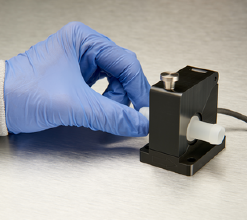 Single-Use PVDF Tubeholder Flow Meter with gloved hand