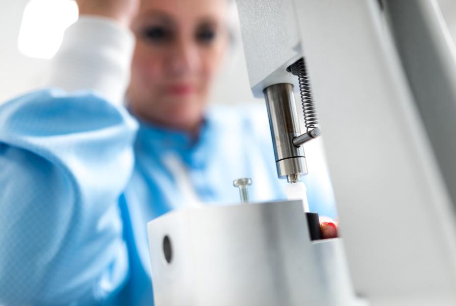 Saint-Gobain employee testing flow meter products in lab
